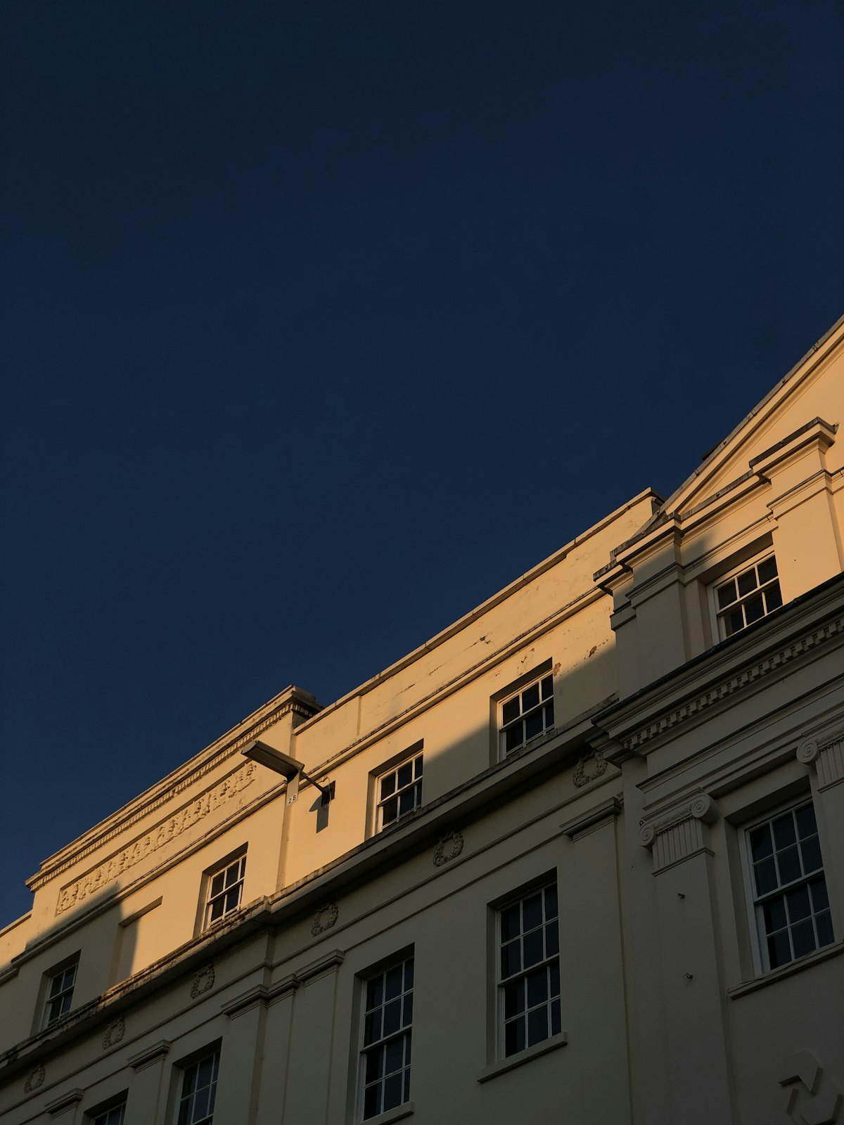 Regency stucco facade catching evening light in Leamington Spa