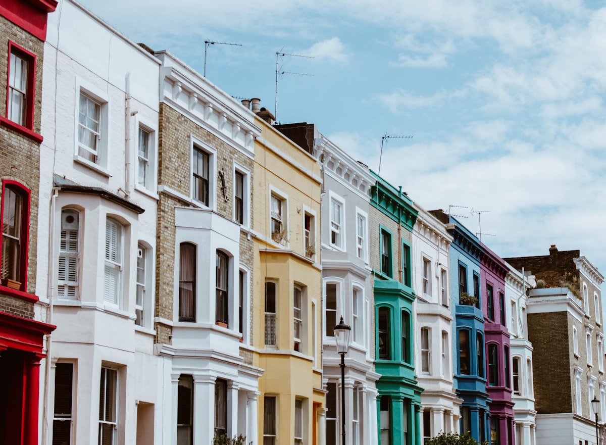 Row of colourful Victorian terraced houses on a British street