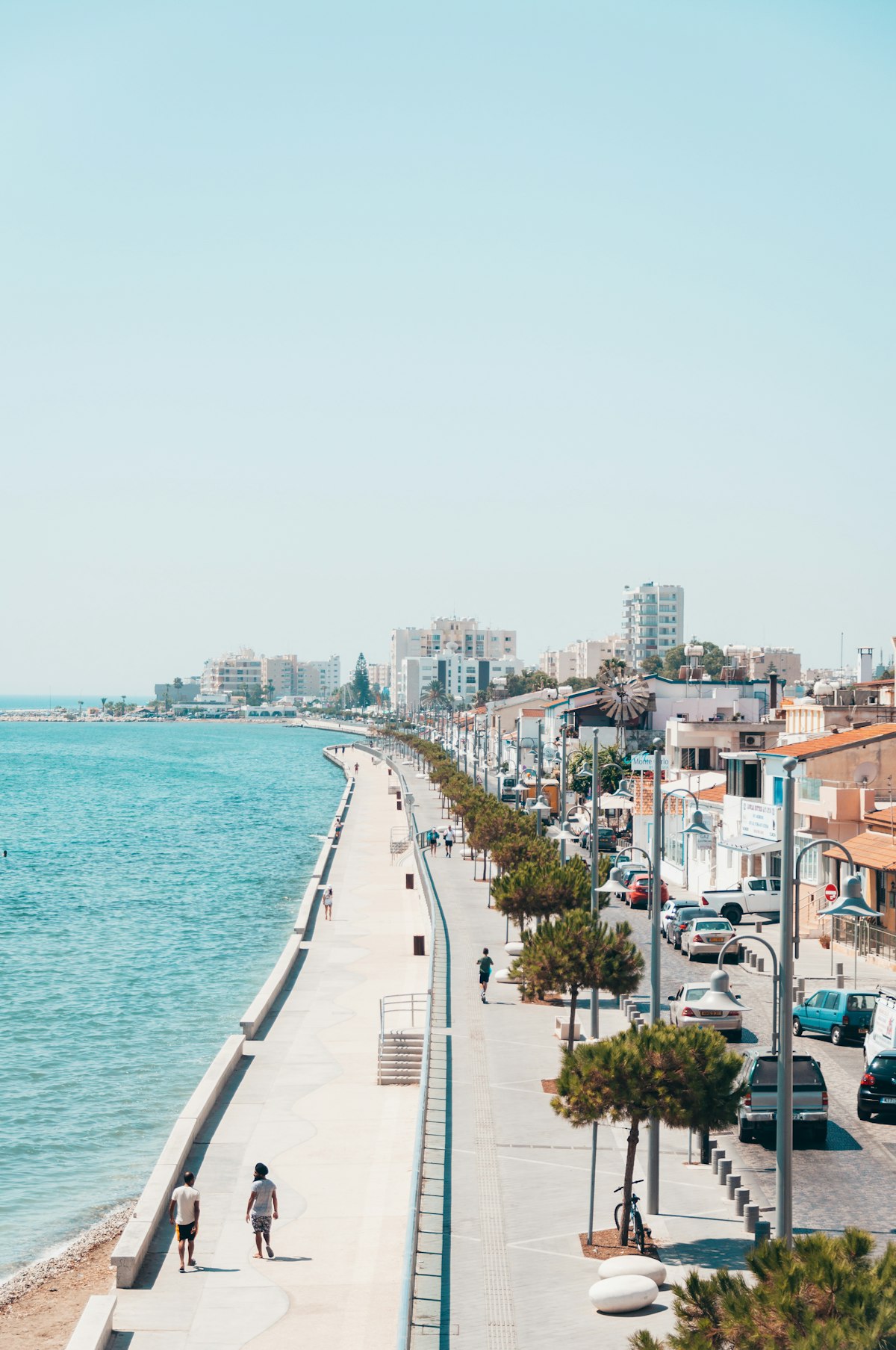 Seafront promenade in Larnaca, Cyprus, with apartment blocks and hotels along the water