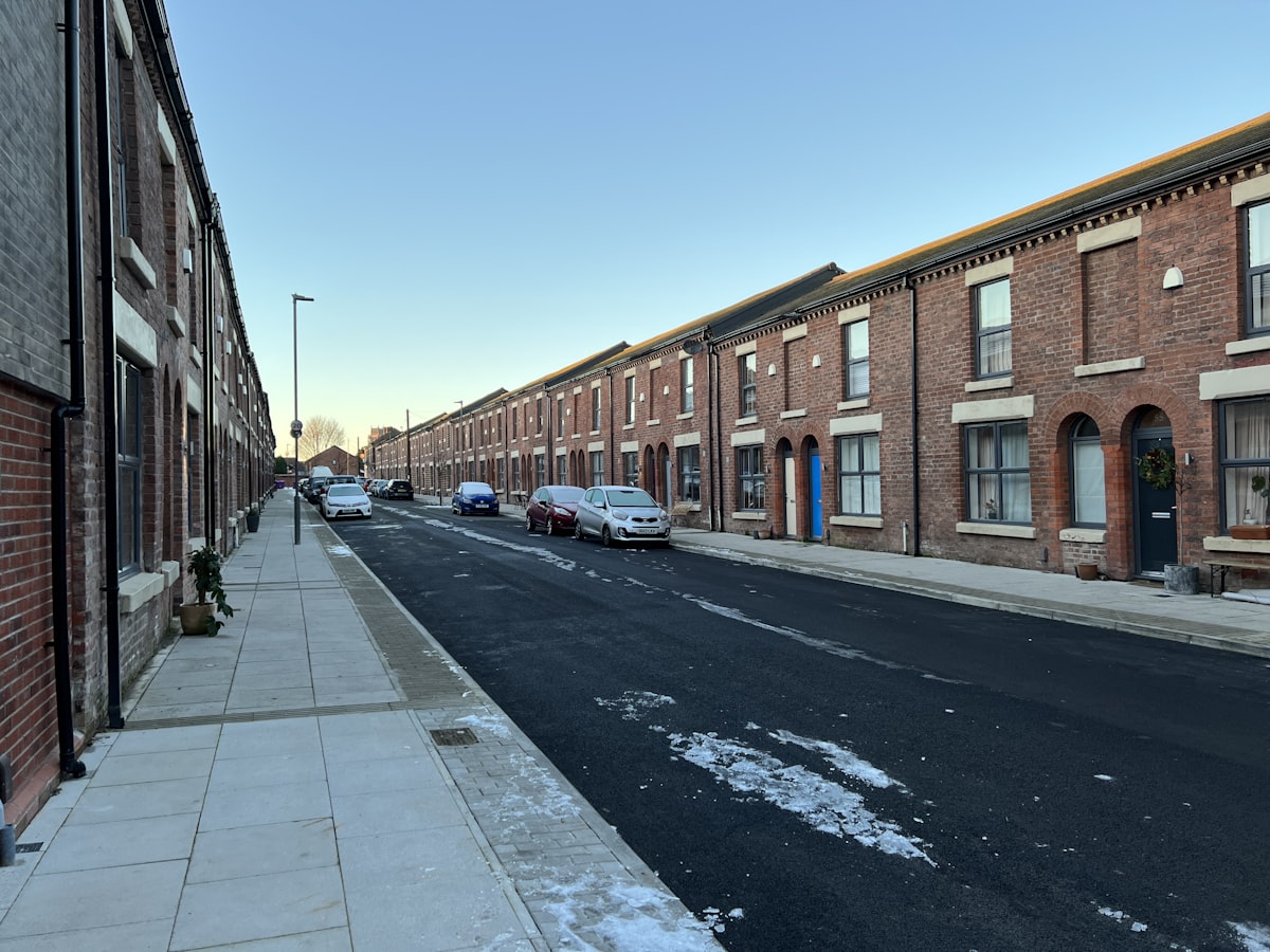 Brick terraced houses along a residential street in northern England