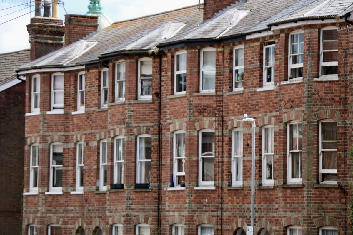 Row of red-brick Victorian terraced houses in England